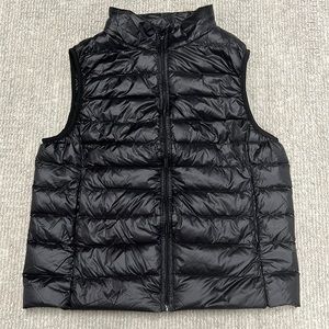 Size M woman’s black puffer vest with pockets